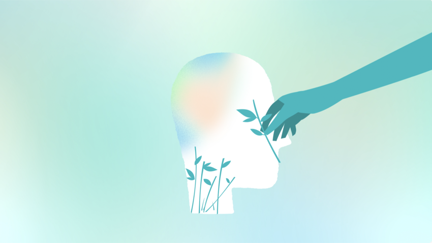 Silhouette of a head with a hand placing a sprig of leaves