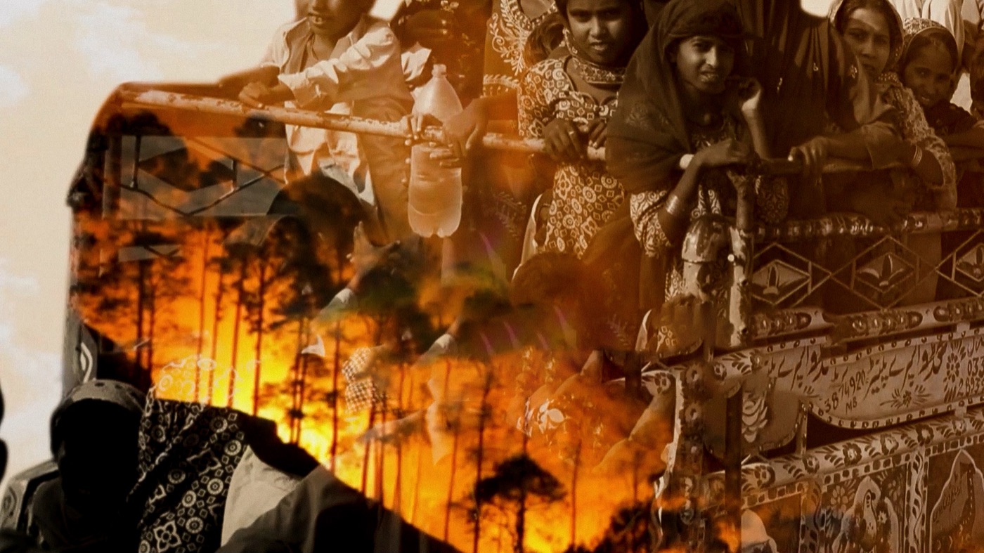 Double exposure of a truck crowded with people layered with a burning forest