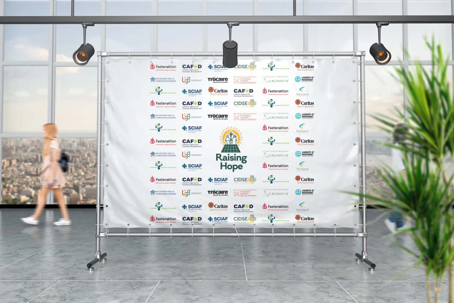Photocall oficial — el logo entre los de dos dicasterios vaticanos y las agencias socias