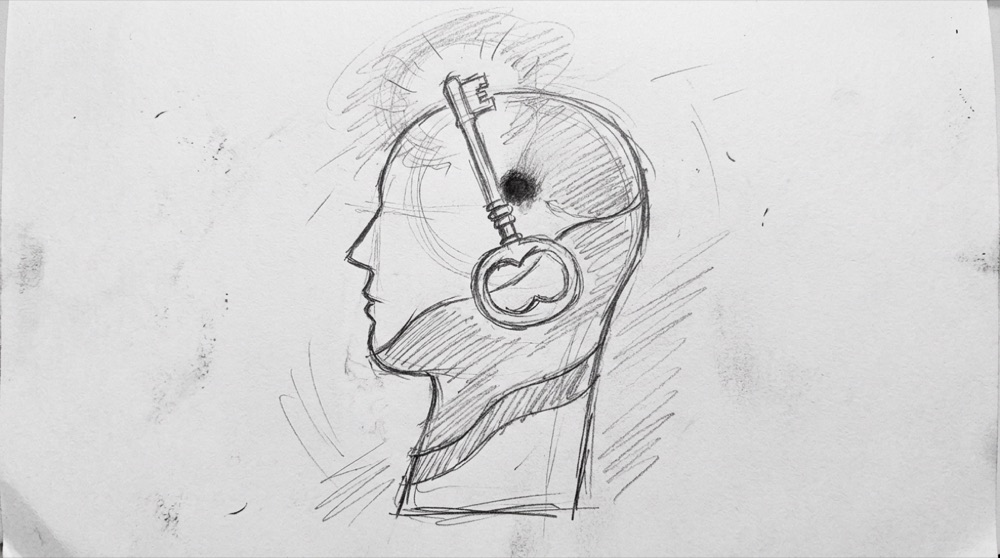 Hand-drawn sketch of a head silhouette with a key