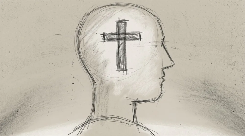 Hand-drawn sketch of a cross within a head silhouette